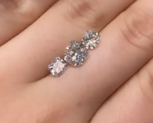 Cushion cut diamond ring on hand