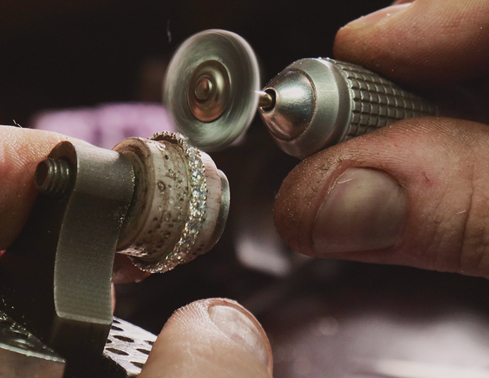 Verifying a stone under magnification at the bench