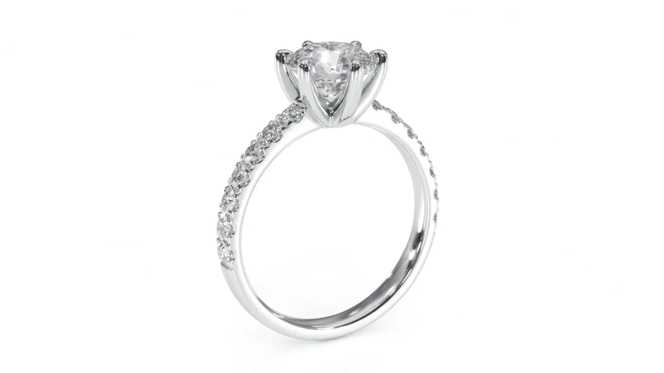 The finished ring shown from the side, with a raised centre stone and smaller diamonds along the band