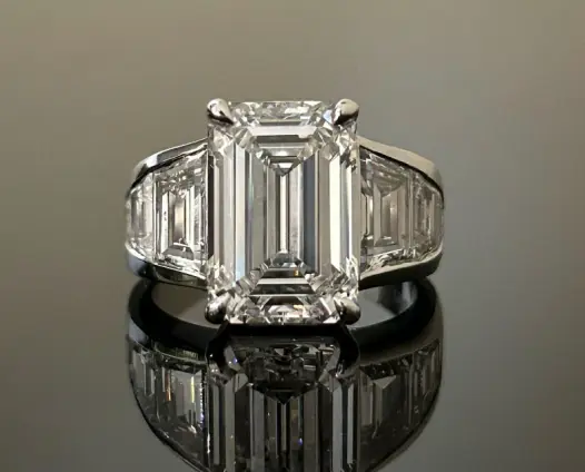 Emerald cut diamond ring with side stones
