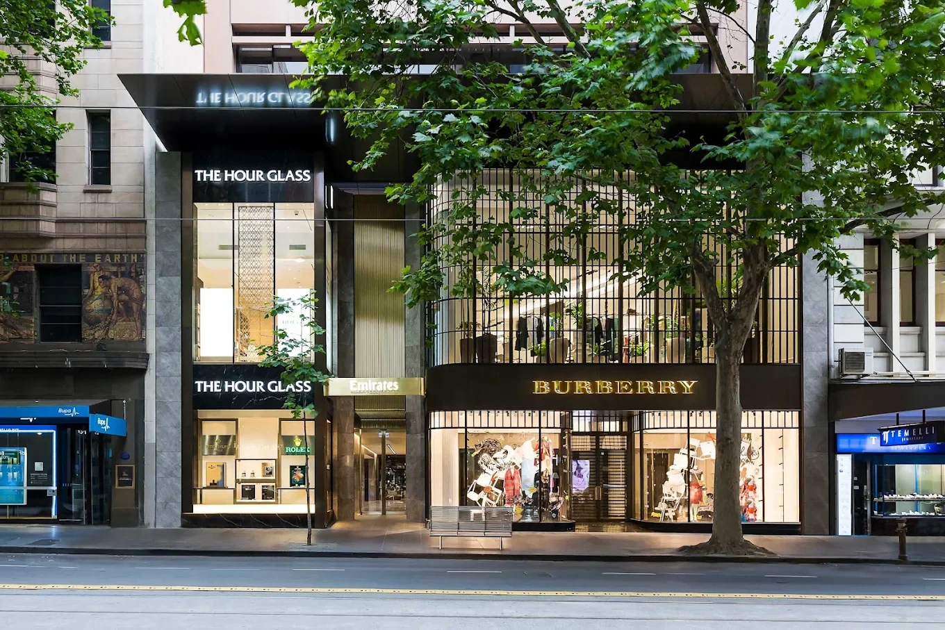 Collins Street building entrance beneath the Emirates sign, between The Hour Glass and Burberry