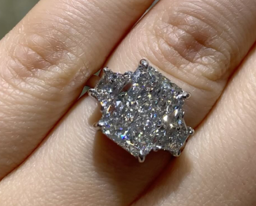 Radiant cut diamond ring on hand