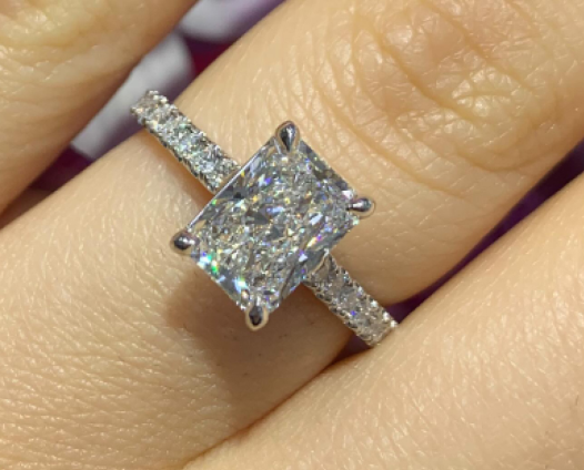 Radiant cut diamond ring on finger