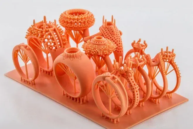 Resin ring models on a 3D printer bed